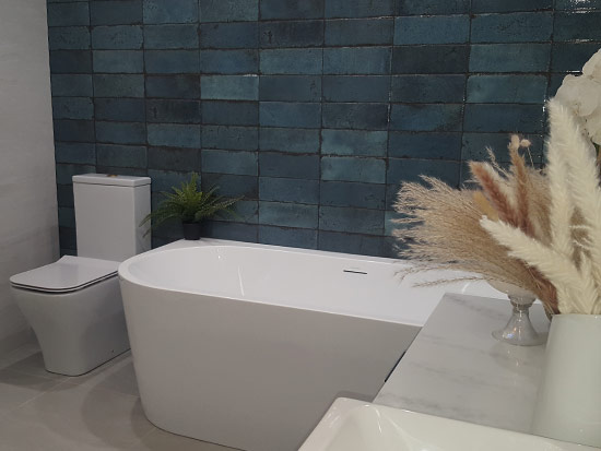 Fitted bathroom with blue tiles